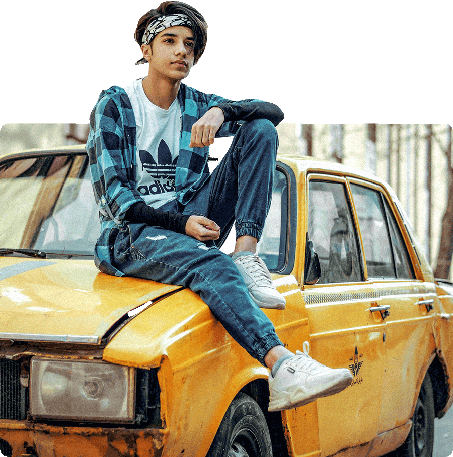 Student sitting on a yellow taxi